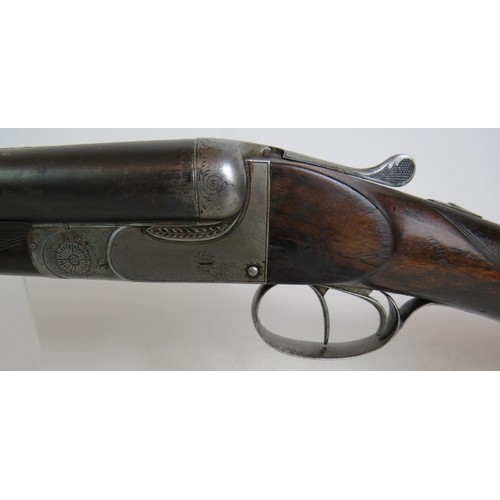 936 - 12 bore side by side, boxlock ejector, double trigger, 25 1/4 barrels, 14 1/4 stock. Barrels inscrib... 