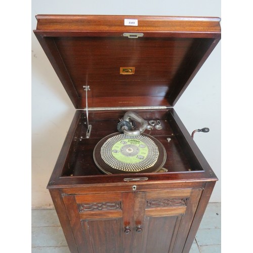 840 - A 1920's oak cased HMV gramophone with Garrard motor, raised on baluster turned supports. Complete w... 