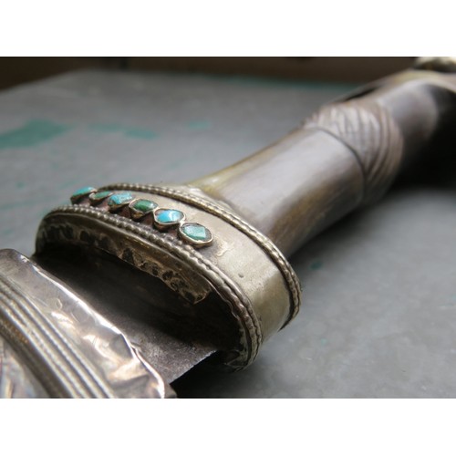 108 - An antique Eastern curved dagger with white metal scabbard and turquoise inlaid horn handle plus an ... 