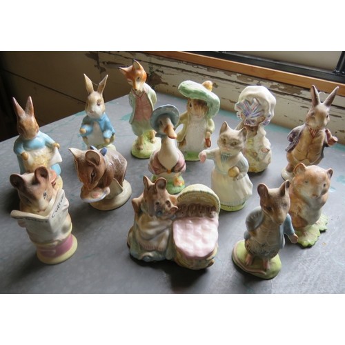 130 - A collection of thirteen Beswick Beatrix Potter figures with gold oval back stamps C1950s. (13). Con... 