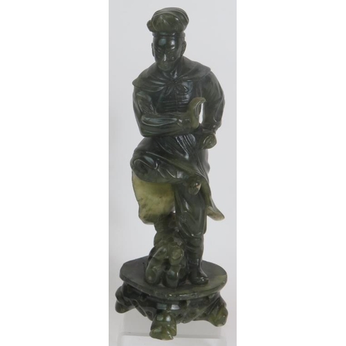 34 - A carved Chinese green Jadeite/Hardstone figure of a male dancer, height 23.5cm, unsigned.
Condition... 