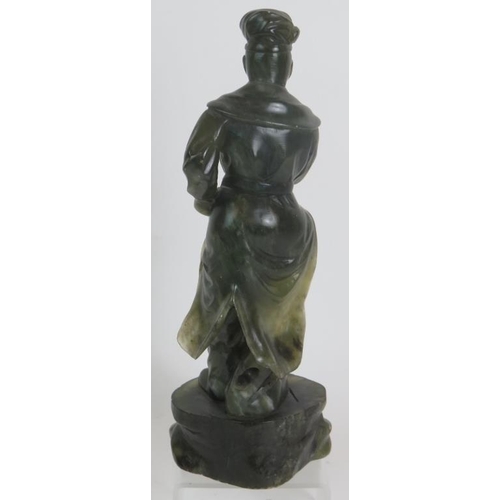34 - A carved Chinese green Jadeite/Hardstone figure of a male dancer, height 23.5cm, unsigned.
Condition... 