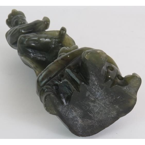 34 - A carved Chinese green Jadeite/Hardstone figure of a male dancer, height 23.5cm, unsigned.
Condition... 