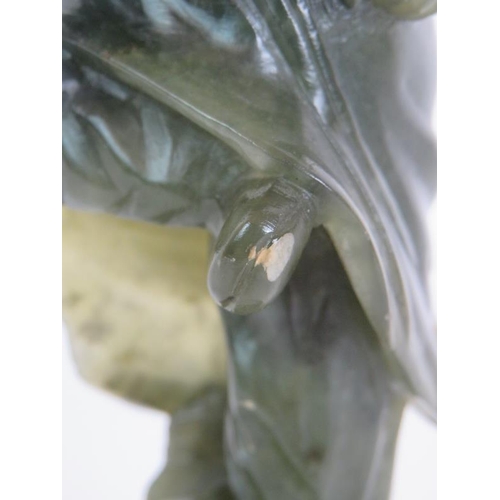 34 - A carved Chinese green Jadeite/Hardstone figure of a male dancer, height 23.5cm, unsigned.
Condition... 