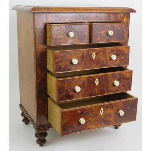 5 - A 19th Century apprentice cabinet of 5 drawers with bird's eye maple veneer finish and turned bone h... 