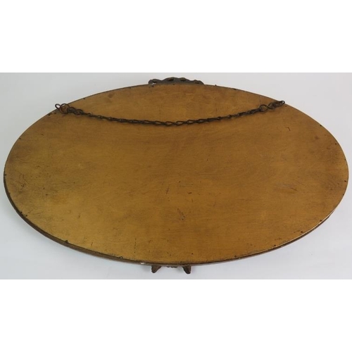 54 - An oval early 20th Century Barbola mirror with floral  moulding and bevelled glass. Width 60cm. Heig... 