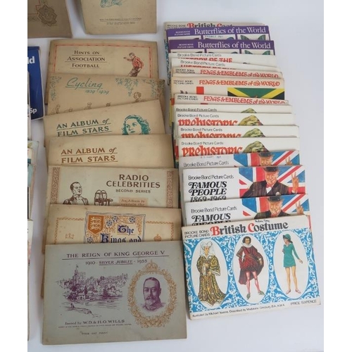 60 - A large collection of cigarette and tea card albums from 1930s to 1970s including WD & HO Wills, Joh... 