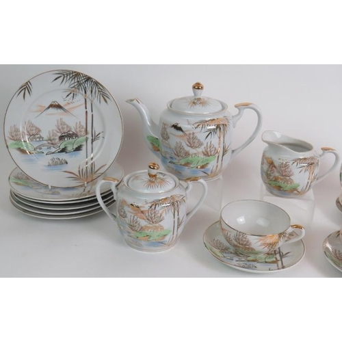 63 - A mid 20th Century  Japanese Kutani part tea set comprising 16 pieces including two Geisha lithophan... 