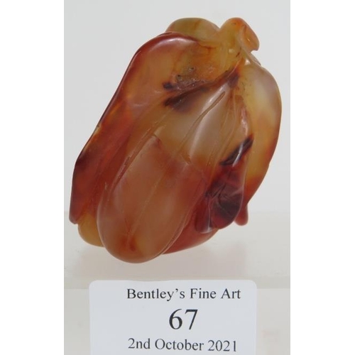 67 - A Chinese carved hardstone snuff bottle of melon and leaf form, probably russet Jade. No spoon. Heig... 