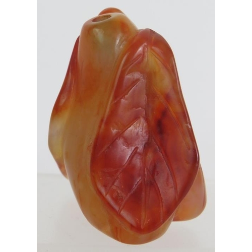 67 - A Chinese carved hardstone snuff bottle of melon and leaf form, probably russet Jade. No spoon. Heig... 