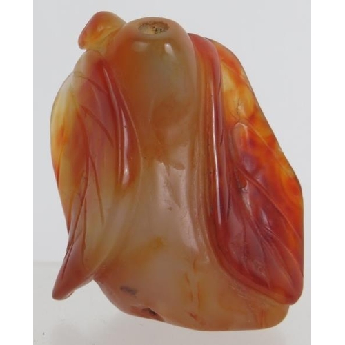 67 - A Chinese carved hardstone snuff bottle of melon and leaf form, probably russet Jade. No spoon. Heig... 