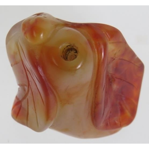 67 - A Chinese carved hardstone snuff bottle of melon and leaf form, probably russet Jade. No spoon. Heig... 