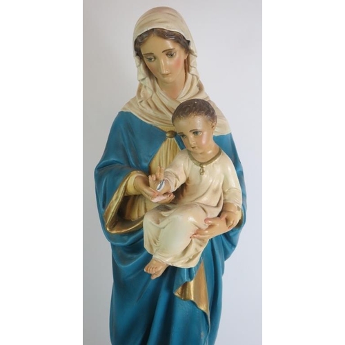 96 - A large vintage plaster figure of the Madonna and child painted in polychrome colours. Height 81cm. ... 
