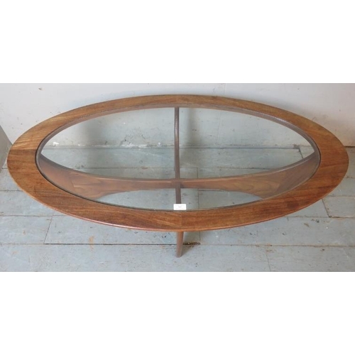 702 - A mid century teak Astro oval coffee table by G Plan with glass inset.
42cm high x 123cm wide x 66cm... 