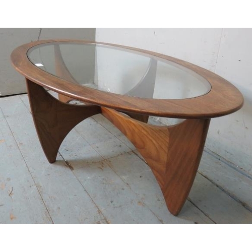 702 - A mid century teak Astro oval coffee table by G Plan with glass inset.
42cm high x 123cm wide x 66cm... 