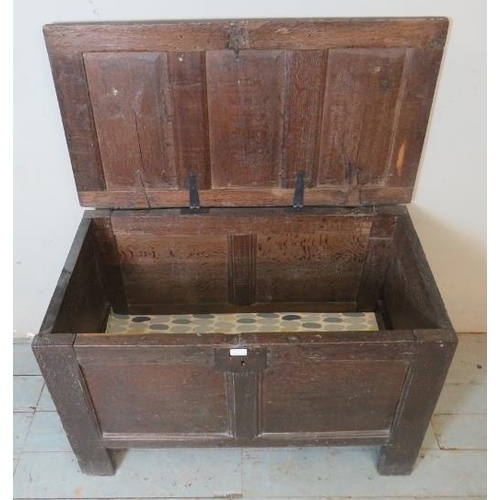 707 - An 18th century oak coffer of small proportions carved with the initials 'T'S', raised on style feet... 