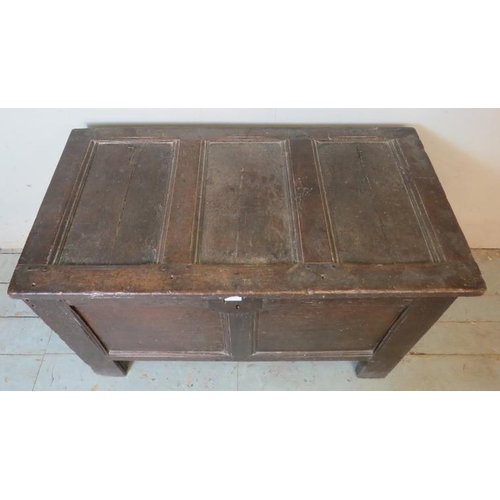 707 - An 18th century oak coffer of small proportions carved with the initials 'T'S', raised on style feet... 