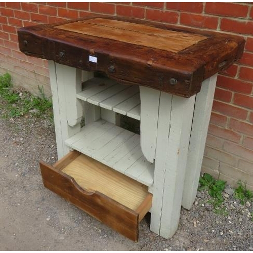710 - A vintage oak butcher's block with under tier shelves and drawer to base.
53cm high x 90cm wide x 57... 