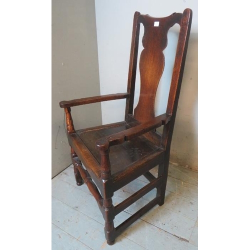 729 - An early 18th century oak carver hall chair of excellent colour and patina.
114cm high x 60cm wide x... 