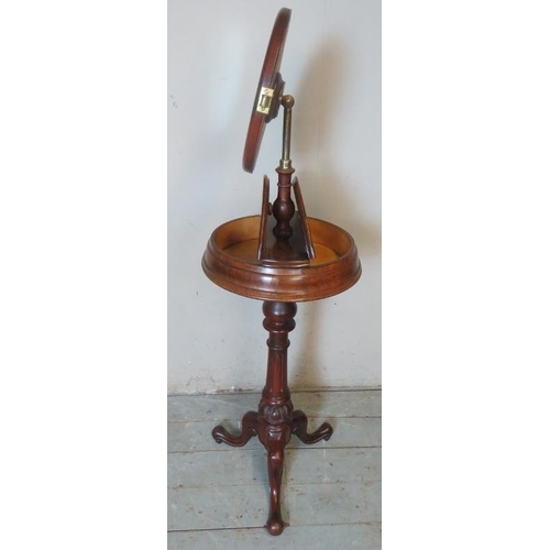 748 - A Victorian mahogany gentleman's shaving stand with height adjustable mirror over two hinged compart... 