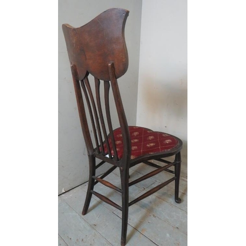 751 - A turn of the century Art Nouveau bedroom occasional chair with unusually shaped back rest and seat ... 