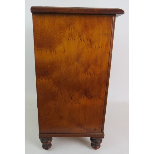 5 - A 19th Century apprentice cabinet of 5 drawers with bird's eye maple veneer finish and turned bone h... 