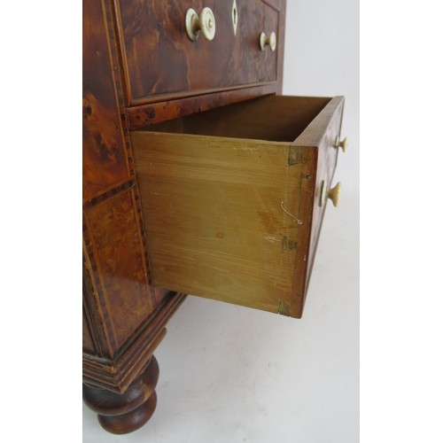 5 - A 19th Century apprentice cabinet of 5 drawers with bird's eye maple veneer finish and turned bone h... 