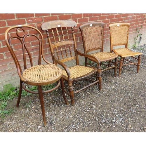 769 - A selection of four bergere chairs to include an elm spindle back carver chair, a Thonet style bistr... 