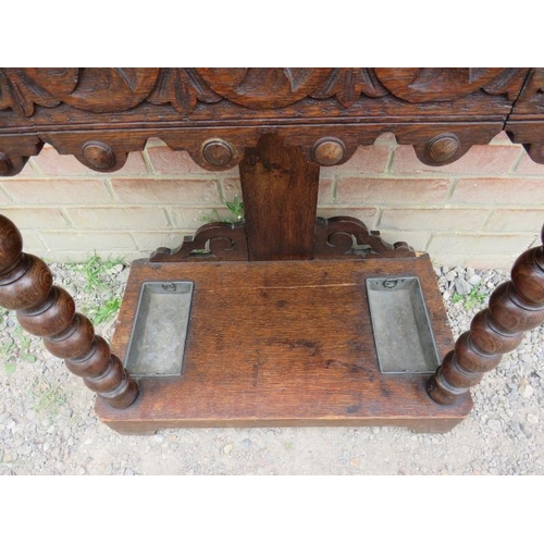 790 - A 19th century oak hall stand heavily carved with roundels & Fleur de Les in the Flemish style, with... 