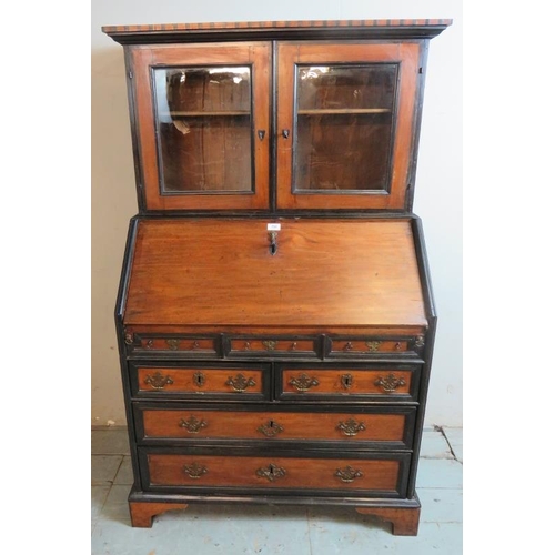 797 - An 18th century Colonial campaign type Georgian mahogany ebonised bureau bookcase with dentil cornic... 