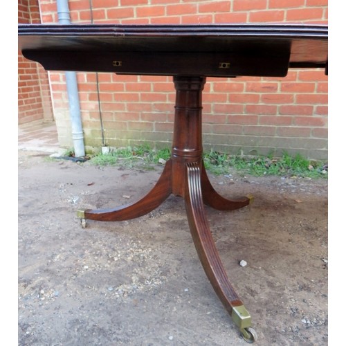 878 - An early to mid 20th century mahogany D end twin pedestal dining table with one extra leaf.
Conditio... 