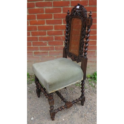 923 - A set of four Victorian oak framed Carolean revival chairs with bergere back panels, carved with vin... 