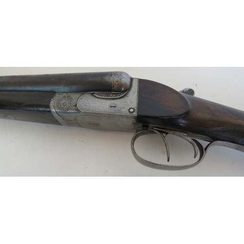 984 - 12 bore side by side, boxlock ejector, double trigger, 25 1/4 barrels, 14 1/4 stock. Barrels inscrib... 