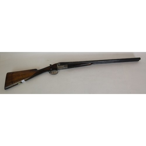 984 - 12 bore side by side, boxlock ejector, double trigger, 25 1/4 barrels, 14 1/4 stock. Barrels inscrib... 