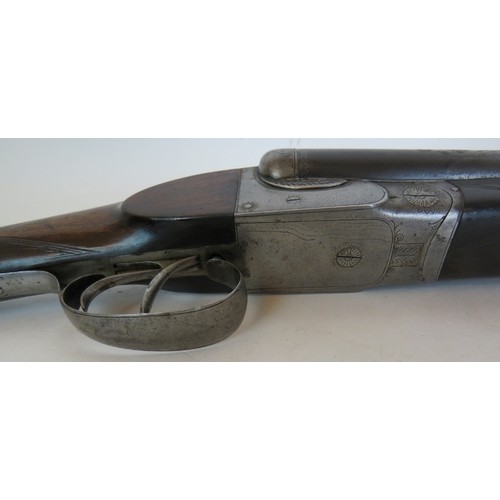 984 - 12 bore side by side, boxlock ejector, double trigger, 25 1/4 barrels, 14 1/4 stock. Barrels inscrib... 