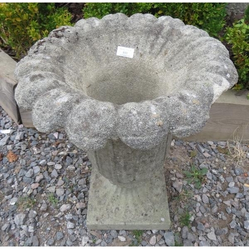 945 - A reconstituted stone planter in the Grecian style mounted on a plinth.
Condition report: Loss to ri... 