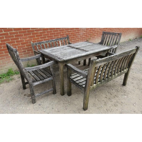 948 - A weathered slatted teak patio table with two benches and two chairs.
Condition report: One bench ha... 