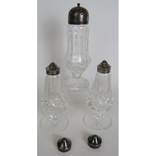 100 - A pair of Waterford crystal cruets with spare tops, pair of Waterford candlesticks, a Waterford suga... 