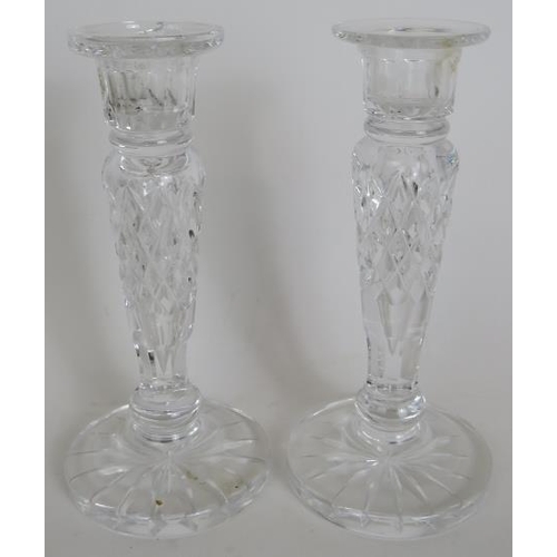 100 - A pair of Waterford crystal cruets with spare tops, pair of Waterford candlesticks, a Waterford suga... 