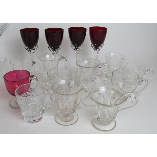 102 - A collection of 22 punch and custard glasses, a cut crystal jug, two tumblers, a 6 piece cruet set a... 