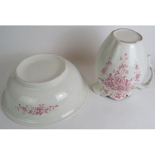 104 - A late 19th/early 20th Century ceramic toilet jug and bowl with relief decoration and peuce floral t... 