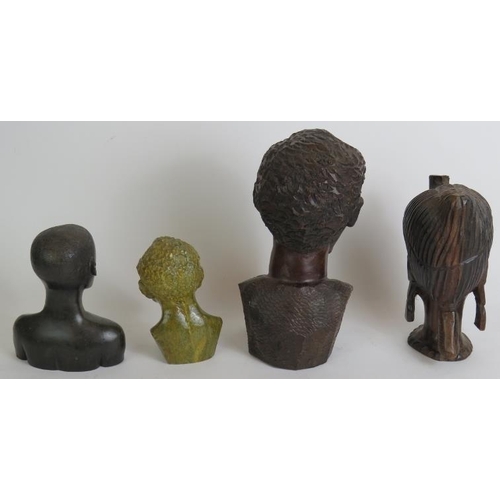 105 - Four decorative carved African tribal busts, three fashioned from hardwood and one from stone. Circa... 