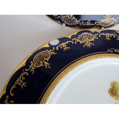 106 - Eight Coalport plates with hand painted game bird decoration and cobalt blue and gilt borders plus t... 