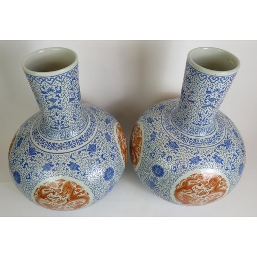 11 - A pair of large Chinese porcelain 'Tianqiuping' bottle vases, probably 20th Century each decorated i... 