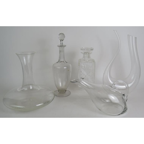 112 - Three contemporary glass carafes, one marked St Clare, plus a cut crystal spirit decanter and a tall... 