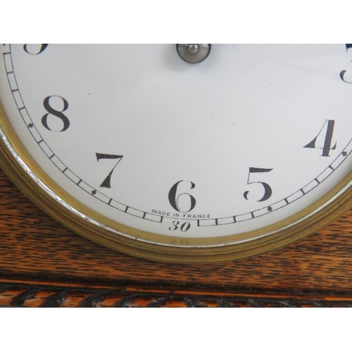 113 - An early 20th Century oak cased French mantel clock with enamel dial. Height 13.5cm.
Condition repor... 