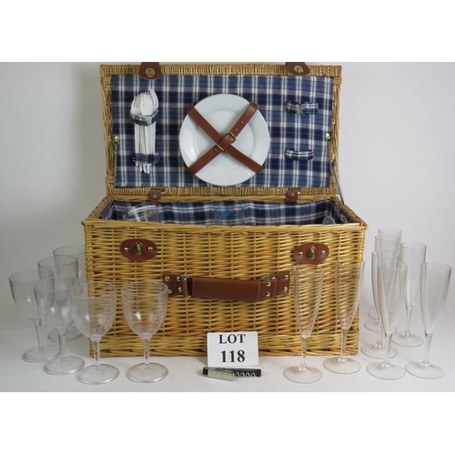 118 - A large Wicker picnic hamper containing various plates, glasses, corkscrew etc. Overall size 56cm x ... 