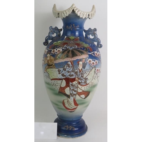 125 - A large Japanese Satsuma ware vase decorated with traditional Geisha scenes. Signed to base.