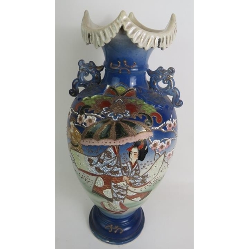 125 - A large Japanese Satsuma ware vase decorated with traditional Geisha scenes. Signed to base.