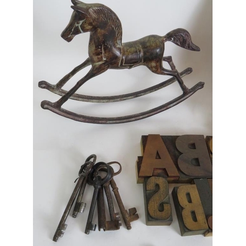 127 - A mixed lot to include wooden printing blocks, binoculars, old keys, candle snuffer, vase trivet, ro... 